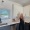 a woman standing in a kitchen