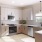 a kitchen with white cabinets